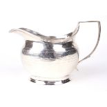 A George III silver cream jug.