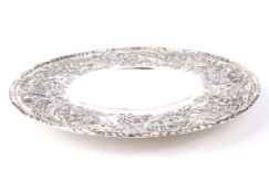 An American Sterling silver embossed circular dish.