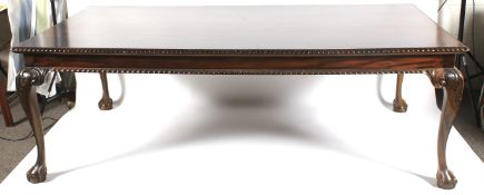 A large 20th century Georgian style mahogany dining table.