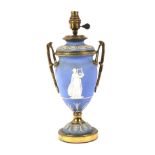 A Wedgwood light blue Jasperware and brass twin handled table lamp.