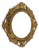 A fine gilt decorated circular wooden framed bevel edged wall mirror.