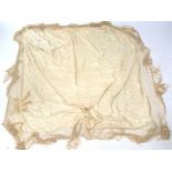 A Chinese cream on cream silk, embroidered shawl.