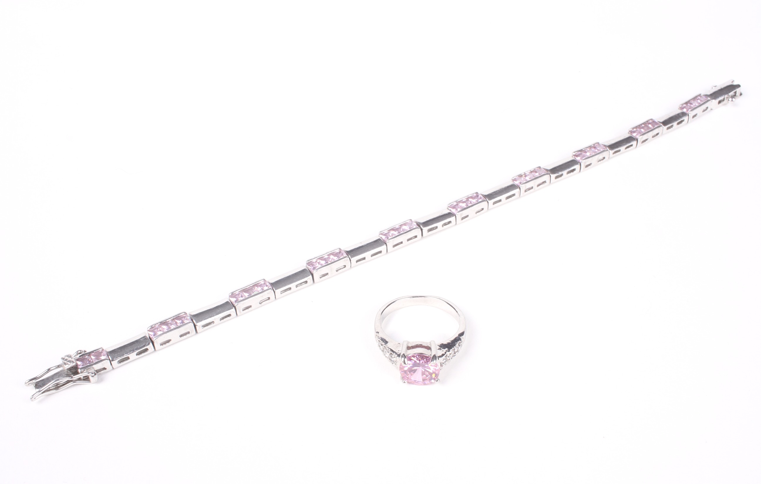 A pink and near-colourless cubic zirconia dress ring and a bracelet.
