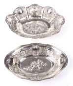 Two Continental white metal pierced oval dishes.