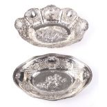 Two Continental white metal pierced oval dishes.