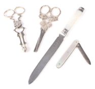 Two pairs of silver grape scissors,