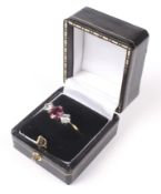 A mid 20th century gold, ruby and diamond three stone ring.