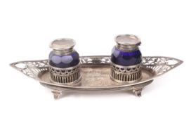 A Victorian silver twin inkwell on stand.