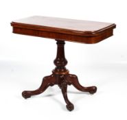 A Victorian mahogany fold over swivel top tea table.