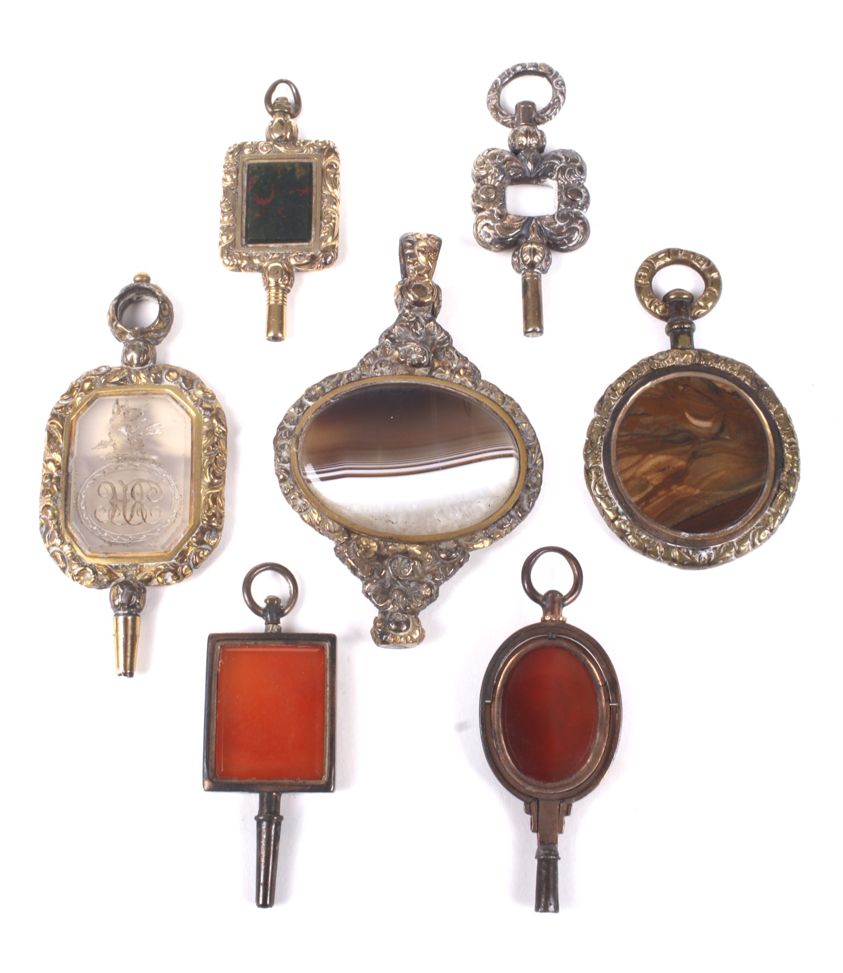 Six late George III and later hardstone set watch keys and another. - Image 2 of 2