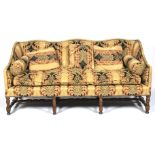 A 19th century upholstered three seater sofa.