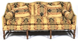 A 19th century upholstered three seater sofa.