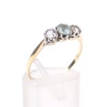 An early 20th century gold, aquamarine and diamond three stone ring.