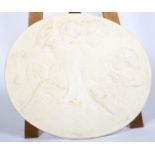 A 20th century plaster oval wall plaque cast with Bacchic cherubs amongst clouds.