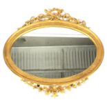 A 19th century giltwood and gesso gilt framed oval wall mirror.