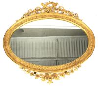 A 19th century giltwood and gesso gilt framed oval wall mirror.