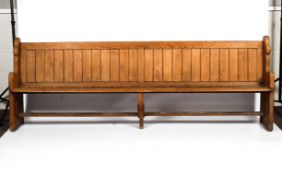 A large 19th century pitch pine church pew.