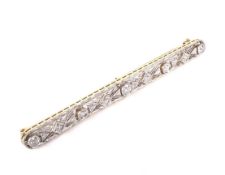 A mid 20th century gold and diamond open bar brooch in Art Deco style.