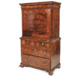 An early 18th century burr walnut secretaire on chest.