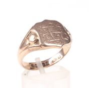 An early 20th century 9ct rose gold shield-shaped signet ring.