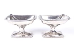 A pair of Edward VII silver pedestal salts.