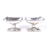 A pair of Edward VII silver pedestal salts.