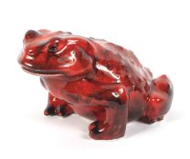 An Anita Harris Art Pottery flambe model of a toad.