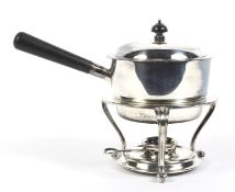 A silver-plated egg coddler on stand.