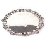 An Egyptian silver card tray. Of scalloped circular form with shell and foliate rim, with .