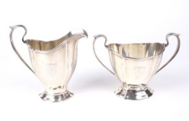 A Sterling silver cream jug and a sugar bowl.