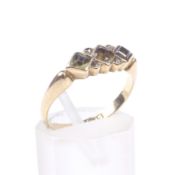 An early 20th century 18ct gold and green-beryl three stone ring with rose diamond points.