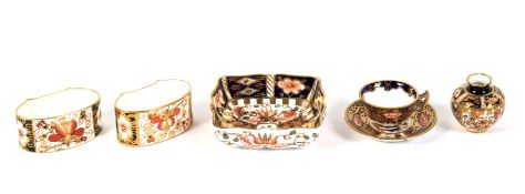 A group of Royal Crown Derby imari patten miniatures and two napkin rings.