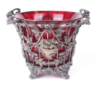 A Victorian silver basket with ruby glass liner.