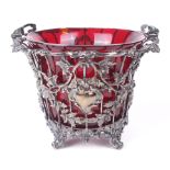 A Victorian silver basket with ruby glass liner.