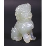 A 20th century Chinese carved pale celadon jade seated Dog of Fo.