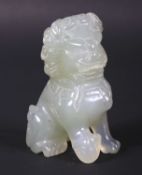 A 20th century Chinese carved pale celadon jade seated Dog of Fo.