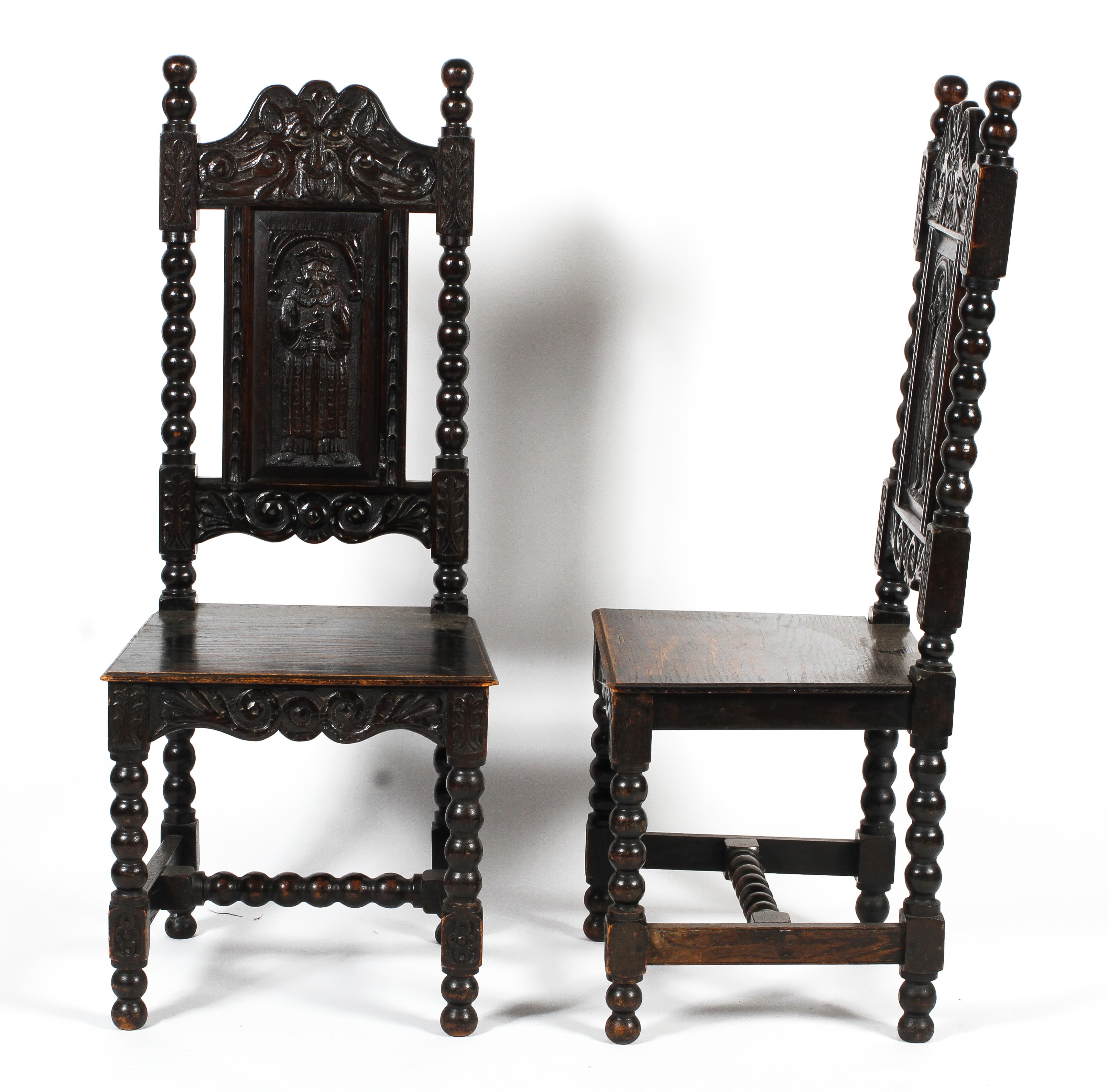 A pair of early 20th century ebonised carved Jacobean style hall chairs. - Image 2 of 3