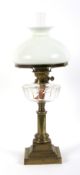 An Edwardian brass column oil lamp.