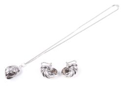 A pair of Italian '750' polished and satinised hollow-spiral earrings, and a pendant and chain,