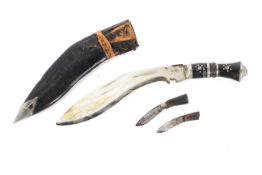 Three cased Khukuri of graduating sizes.