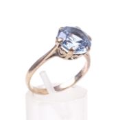A vintage 9ct gold and bright-blue synthetic-spinel single stone ring.