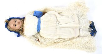 A 19th century wax headed doll.