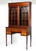 An Edwardian inlaid mahogany astragal glazed bookcase-writing desk.