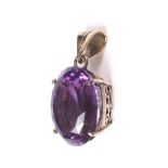 A vintage yellow metal and amethyst pendant.