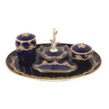 A late 19th century Worcester (Graingers & Co) blue-ground 'jewelled' dressing table set.