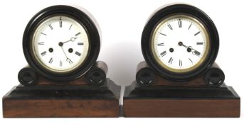 A pair of similar mahogany and ebony Art Deco mantle clocks.