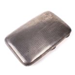 A silver engine turned cigar case.