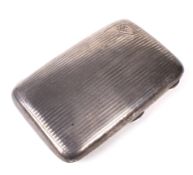 A silver engine turned cigar case.