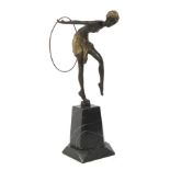 An Art Deco bronze sculpture of a dancing woman with hoop after Erte.