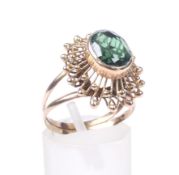 A vintage green synthetic spinel single stone ring.